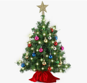 artificial Christmas tree with decorations, tree skirt and a tree topper